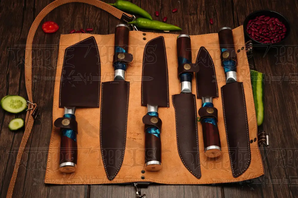 Hand-forged Damascus steel paring, chef, santoku and cleaver knives